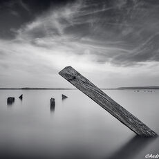 Out Of The Depths wooden structure emerging from the sea at high tide