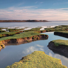 The Skern Sunrise over a coastal salt marsh in North Devon