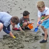 Mike Hubbard - Grandchildren playing in sand on the beach