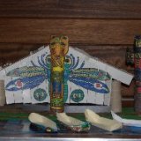 A Haidan style plank house, totum pole and canoes made from paper.