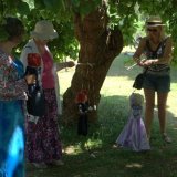 Performing a puppet show under the Black Mulberry tree.
