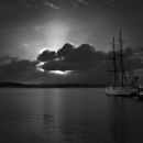 Sail ship under a low Sun