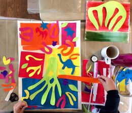 Student work during a "Inspired by Matisse" cut out workshop Hands of an artist working with paper cut outs in the style of Matisse. Sarah Duffield workshops