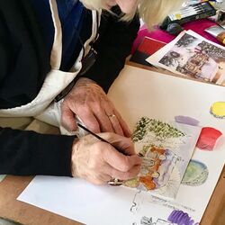 Student working during a "Pen and Wash" workshop Image of an artist working in washes whilst seated at a table. Sarah Duffield art workshop