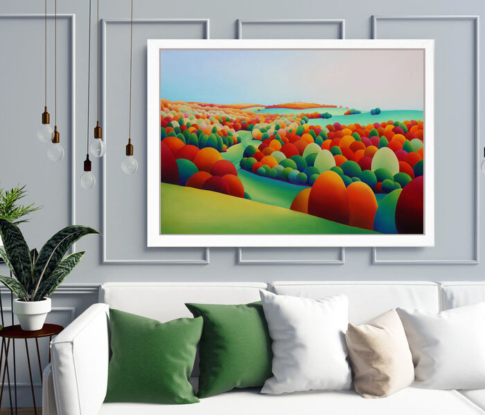 Original Landscape painting by Sarah Duffield displayed in a white frame above a sofa with dark green scatter cushions.