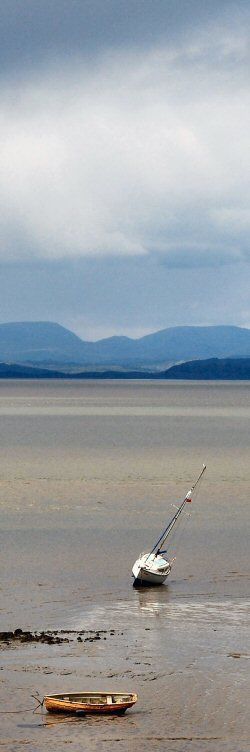 morecambe bay towards the lakeland hills with boats