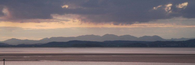 morecambe bay towards the lakeland hills at dusk