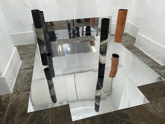 Grouped, cylidrical etching on paper held with small magnets,suspended over mirrors. Scarification solo exhibition,Kendal Museum Cumbria