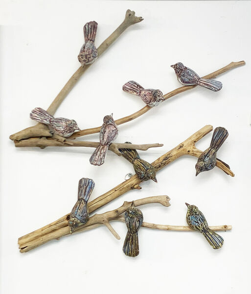 Carved birds on a branch