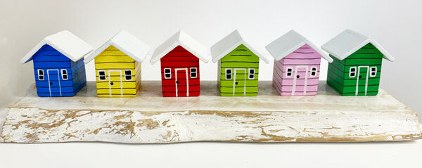 A Row of 6 Beach Huts on natural wood base