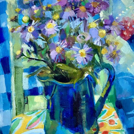 flowers in blue coffee pot