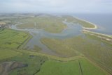 Aerial view of Burnham Overy Harbour the East end of Scolt Head Island and Gun HIll