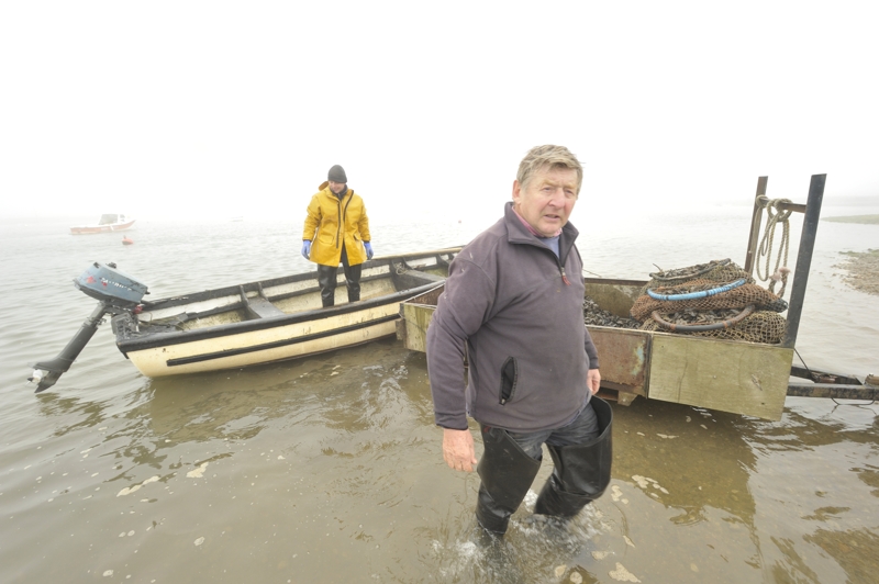 Cyril and Ben Southerland unloading Mussels at the Staithe