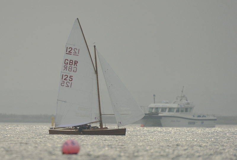 GBR Sharpie in full sail racing in Brancaster Harbour North Norfolk