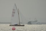 GBR Sharpie in full sail racing in Brancaster Harbour North Norfolk