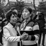 Two women dancing in a park, Xian