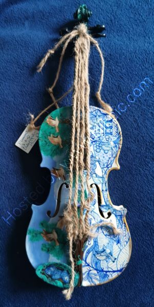 A completely unique hand-decorated 1/8 size Lark fiddle, themed from the traditional song 'Pleasant and Delightful, the refrain of which is 'and the larks, they sang melodious'.  Third photo
