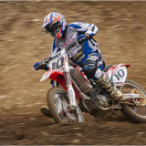 Motocross rider battling on