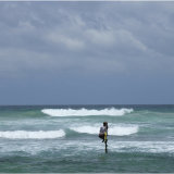 Stilt Fishers against a threatening sky