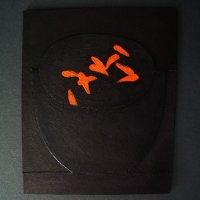 black bowl with marigold petals