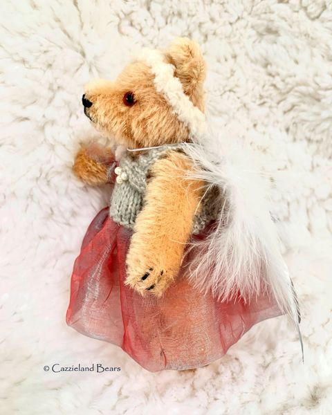 Holly with tiny angel wings