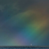 Boats in rainbow light