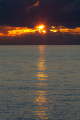 Black cloud, gold sky
