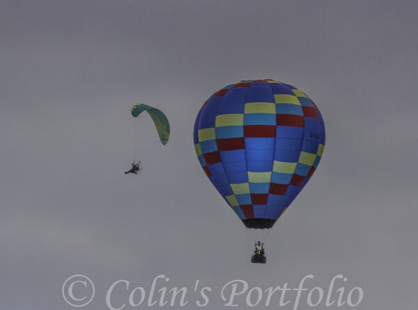 A microlight circling the balloon