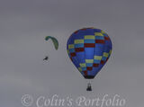 A microlight circling the balloon