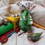 Little cat in green dungarees nfs