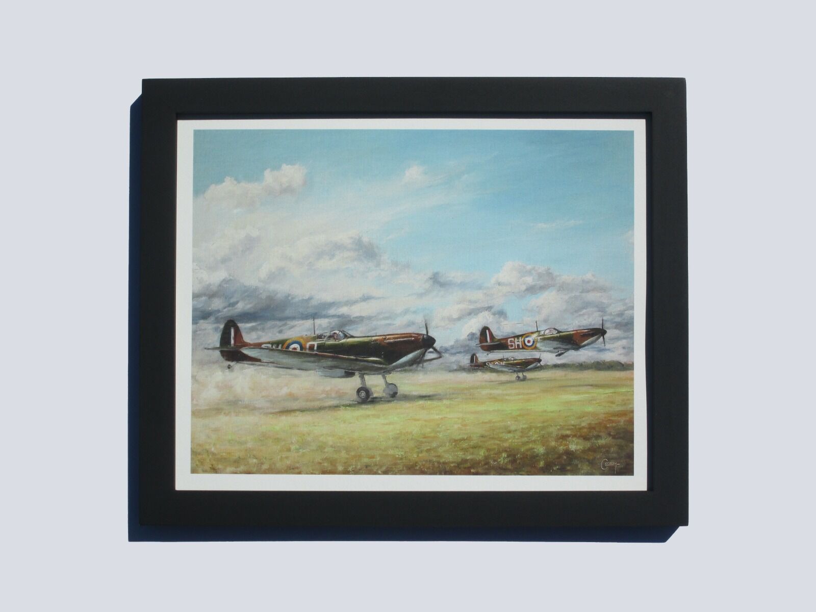 A.R. D. MacDonell's Spitfire taking off with two other Spitfires on a dusty airfield at Kenley.