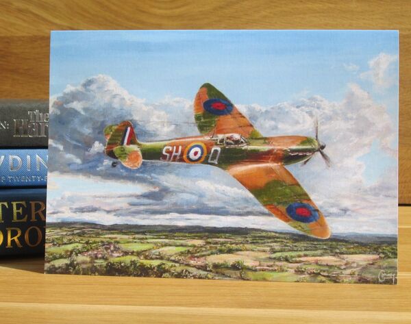 'A Long Way From Home' - Spitfire of P/O. A. G. Donahue, 64 Squadron, Surrey, 1940. (AV15) Painting of a Spitfire flying low over the North Downs.