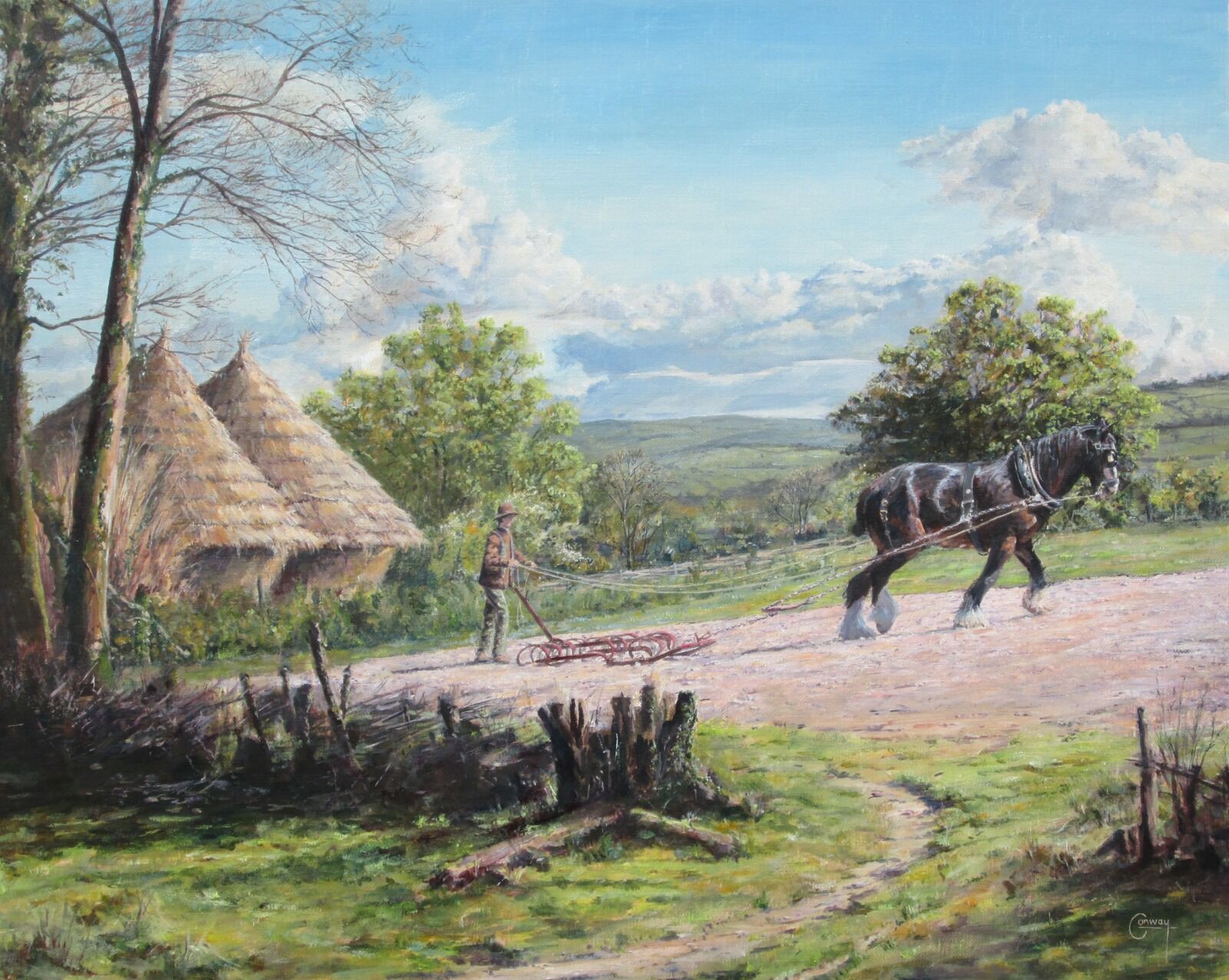 A man and horse at work harrowing a field, with ricks, hills and sky beyond.