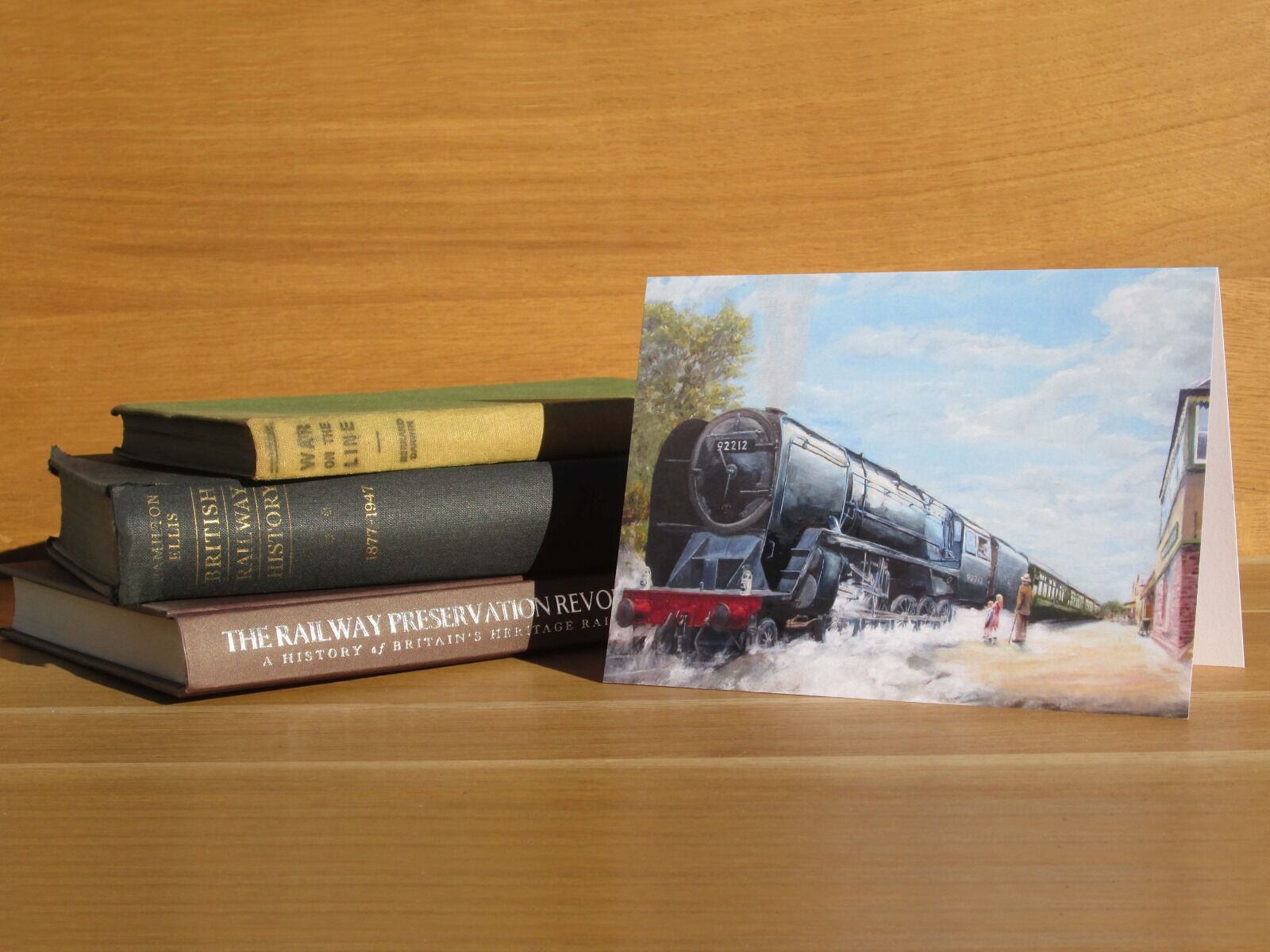 Painting of locomotive departing station watched by grandfather and granchildren.