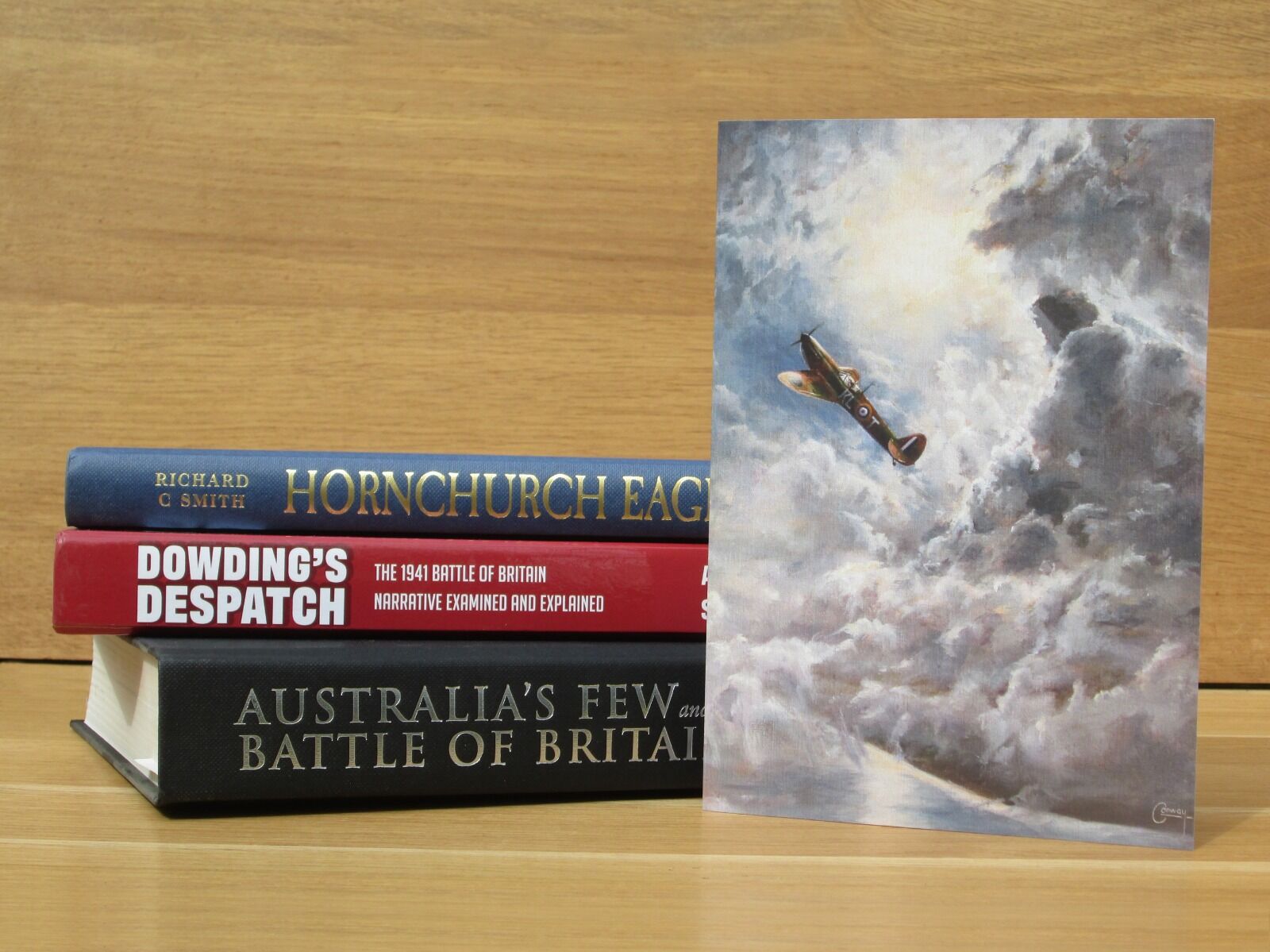 Spitfire flies up through clouds in front of the sun