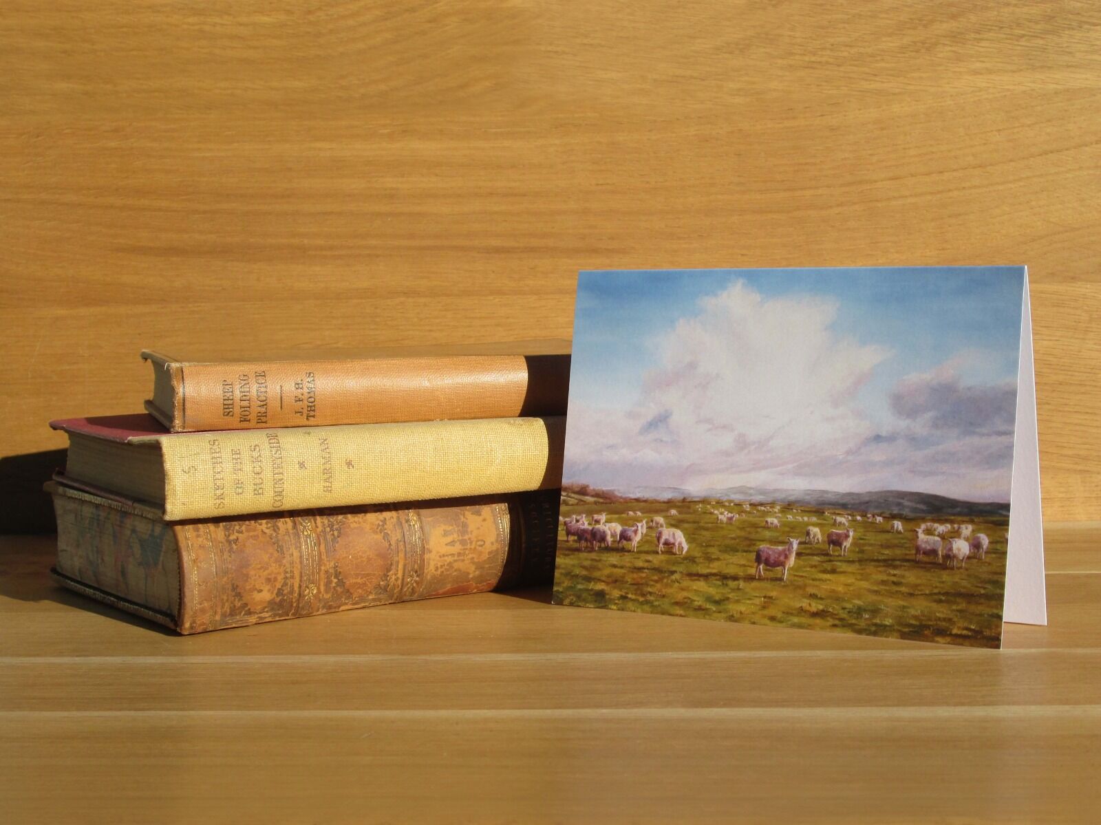 Painting of sheep on a hilltop