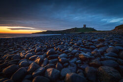 Dunstanburgh rocks by Adrian Gidney - Highly Commended