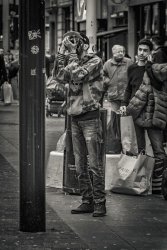 I am watching a guy photograph a lamp post by Alan Wilson - Commended