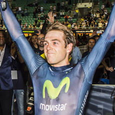 Alex holds the bike aloft