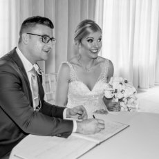 Jen and Rich sign the register