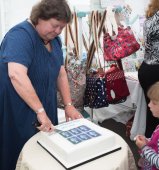 Lacey Street, Sarah cutting the CWK stamp cake