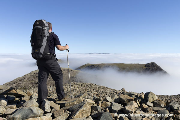 01M-3349 Walker on the Summit of Scafell Pike Looking North Over Broad Crag and Ill Crag Lake District Cumbria UK