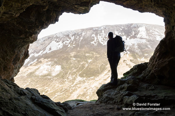 02M-1244 Walker Looking Out of the The Inchnadamph Bone Caves Assynt Sutherland Scotland