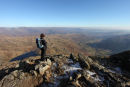 03D-0811 Hill Walker on the Mountain of Harrison Stickle Enjoying the View over Great Langdale Towards Lake Windermere Lake District Cumbria