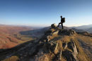 03D-0903 Hill Walker on Pike Howe and the View Down Great Langdale Towards Lake Windermere Lake District Cumbria UK