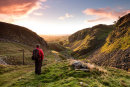 03M-7543 Hiker Enjoying the View East Along Holwick Scar, Upper Teesdale, County Durham UK
