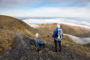 04D-0637 Two Walkers Watching People Scrambling Along Sharp Edge on Blencathra With Clouds Below Lake District Cumbria