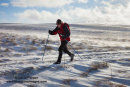 06D-8160 Cross Country Skier Skiing Through Drifting Snow in the North Pennines Upper Teesdale County Durham England UK