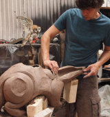 Creating a clay badger using coils of clay