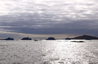 Boats and silver seas off Isabela